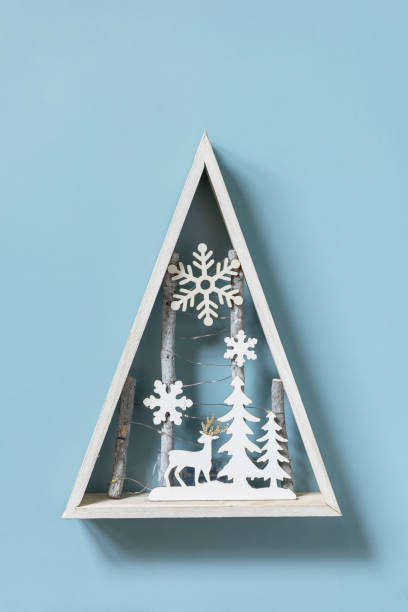 istock Christmas mockup with fir tree Christmas decor on blue background. Preparation for celebration xmas. Copy space. 1354218945