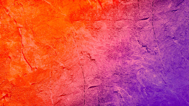 istock Orange purple blue abstract background. Gradient. Toned rough surface texture. Painted concrete wall. 1354219503