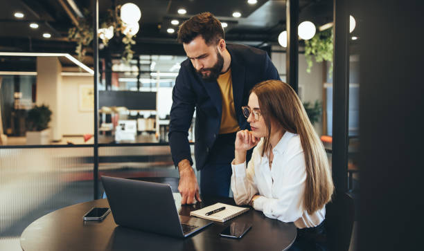 istock Focused businesspeople collaborating on a project 1354221435