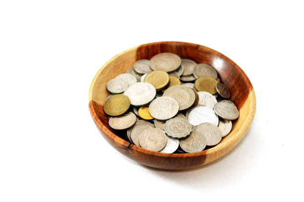 istock collection of different coins from multiple countries around the world background in a brown wooden bowl isolated on a white background 1354223928