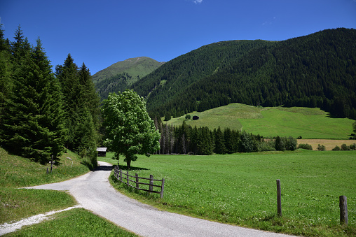 The road at the end of the Gsies valley indicates the direction to reach the alpine huts and pastures on the mountains