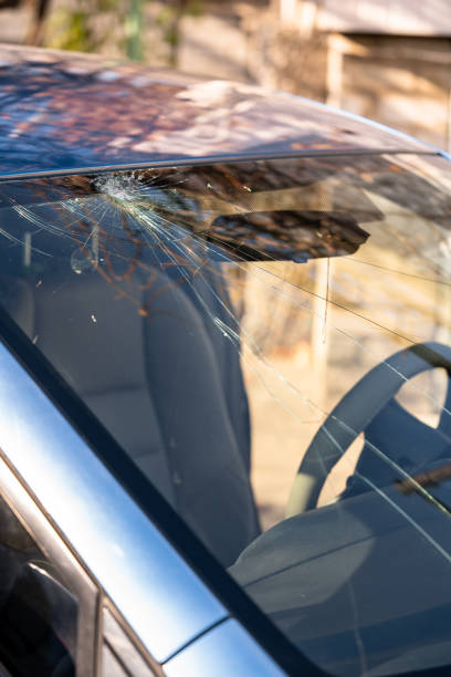 istock Broken windshield of a car with cracks. Car accident. Selective focus 1354225331