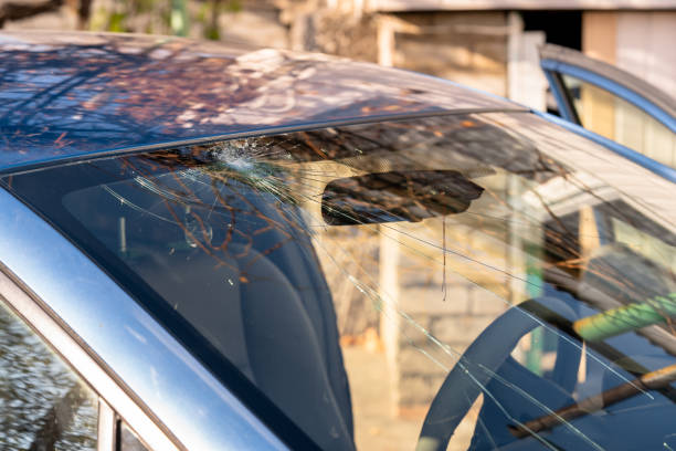 istock Broken windshield of a car with cracks. Car accident. Selective focus 1354225349