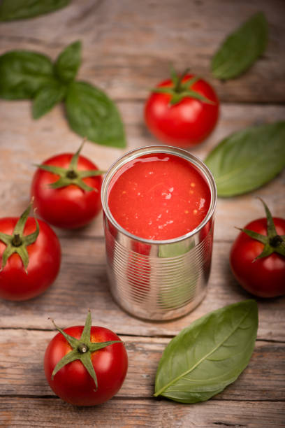 istock A canned tomatoes from above on wooden table 1354225830