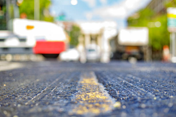 istock close view of the pavement before being asphalted. workers at the bottom 1354227638