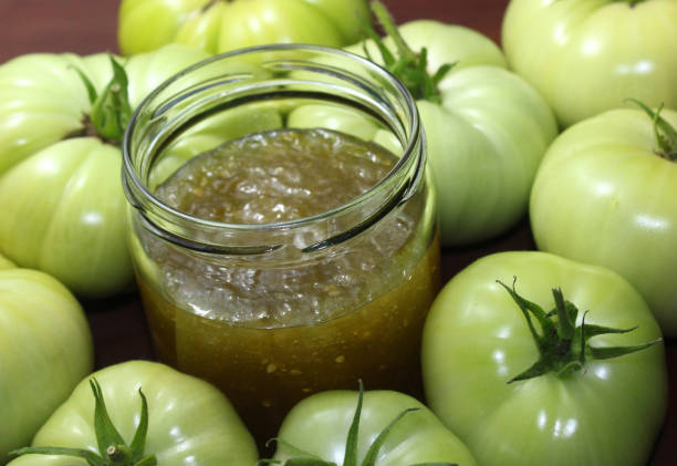glass with marmalade with green tomatoes