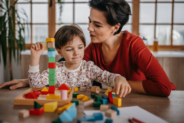 istock Mom and daughter playing time 1354228662