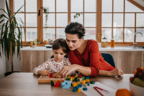 istock Mom and daughter playing 1354228729