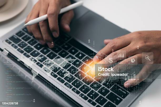 The Concept Of Digital Software Development Technology Programmer Or Software Developer Is Coding Javascript On A Laptop Computer With Technical Icons And Network Connection Stock Photo - Download Image Now