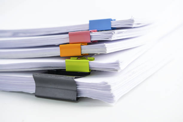 istock Stack of report paper files in business office clips. 1354228891