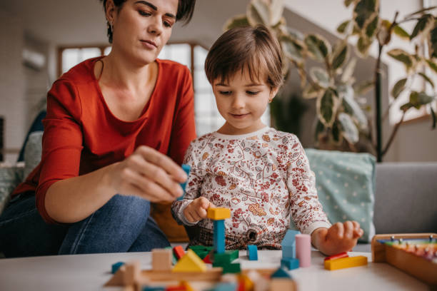 istock Mother and daughter playing 1354228911