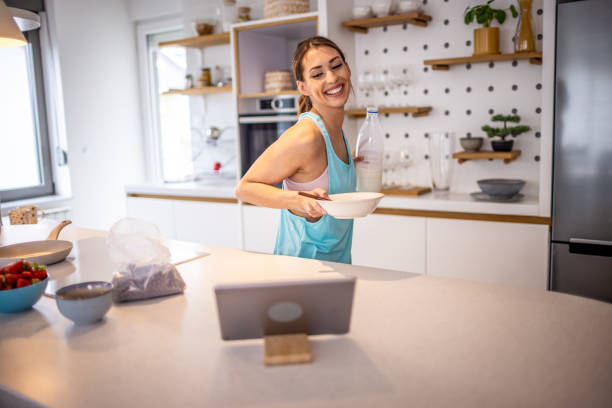 istock Sporty young woman having breakfast after training 1354231431