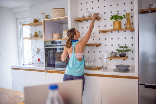 istock Fitness woman preparing healthy breakfast after training 1354231472
