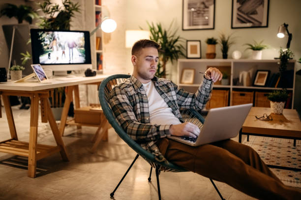 istock Man working at home late at night 1354232347