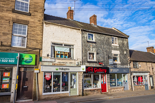 Duffield Art Gallery on Bridge Street of Belper in Derbyshire, England, with other shops visible in the background