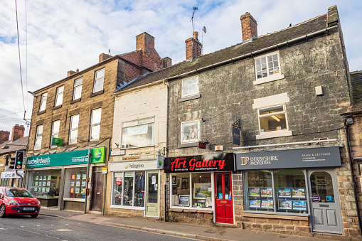 Pellegrino Leather Goods Shop on Bridge Street of Belper in Derbyshire, England, with other shops visible
