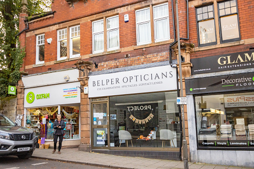 Belper Opticians on King Street in Derbyshire, England, with people visible outside