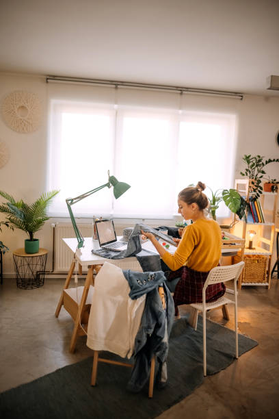 istock Young fashion designer working in office 1354234874