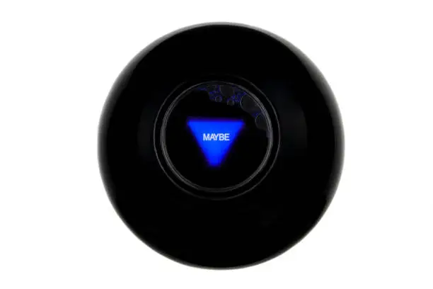 Magic 8 ball with prediction MAYBE isolated on white background