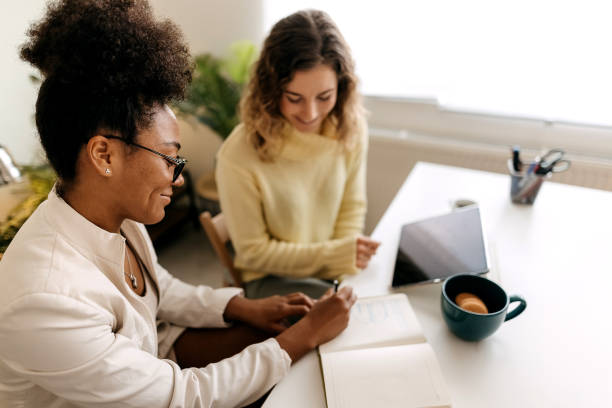 istock Two business women working in office 1354239461
