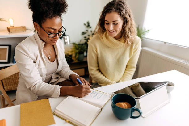 istock Two business women working in office 1354239494