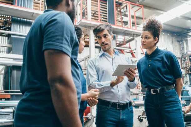 istock Team meeting on the plastic recycling factory 1354240314