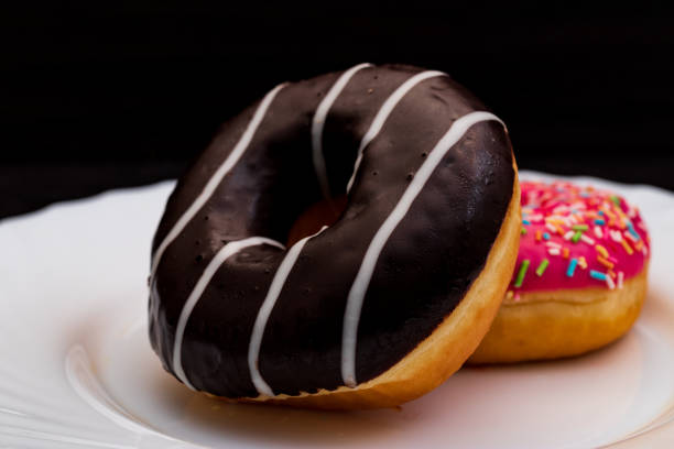 istock sweet chocolate donut on a white plate 1354241190