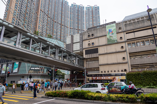 Hong Kong - November 19, 2021 : People walk past the Yeung Uk Road Municipal Services Building in Tsuen Wan, New Territories , Hong Kong.