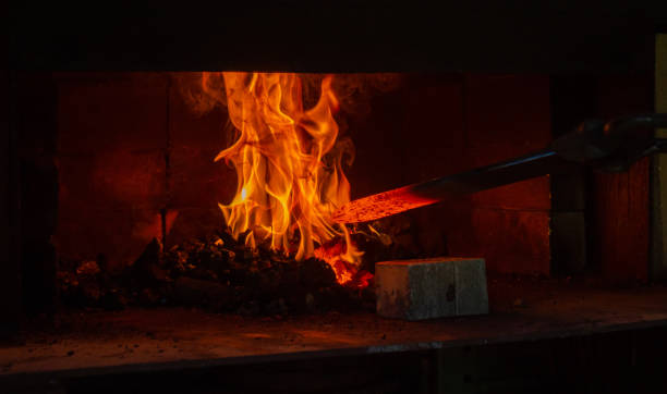 istock Blazing red hot and ready to begin hammering into shape. 1354243332