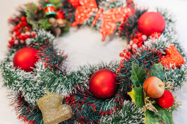 istock christmas wreath on a wooden background 1354243875