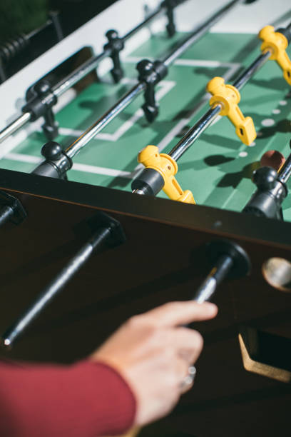 istock Playing table football foosball 1354244454