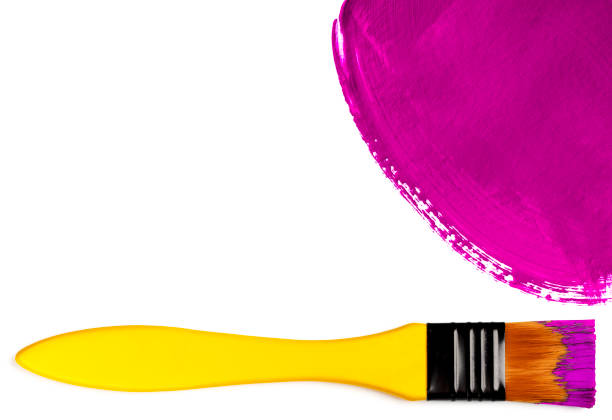 istock Paintbrush with pink painted spot (isolated on white) 1354245416