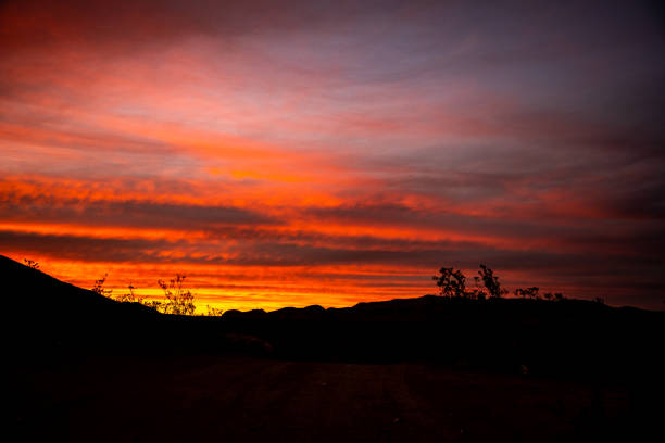 istock Streaky Orange Sunset Over Hills in Big Bend 1354246347