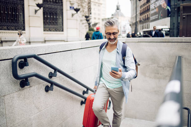 istock Mature tourist going out from the subway 1354249509