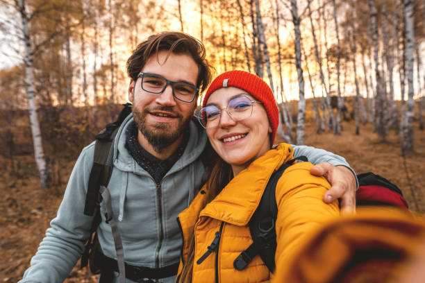istock Young couple taking selfie on camping 1354250965
