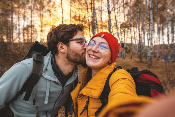 istock Young couple taking selfie on camping 1354250979