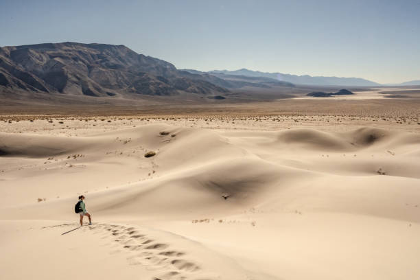 istock Hiker Looking Out Over The Panamint Dunes and The Valley Beyond 1354252495