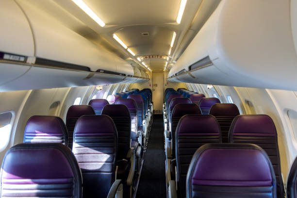 istock Empty airplane seats the cabin with armchairs in interior 1354252601