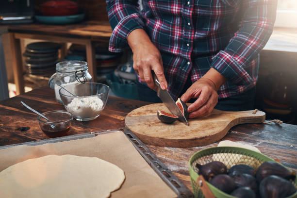 istock Preparing Fig Pizza with Ricotta and Honey 1354252797