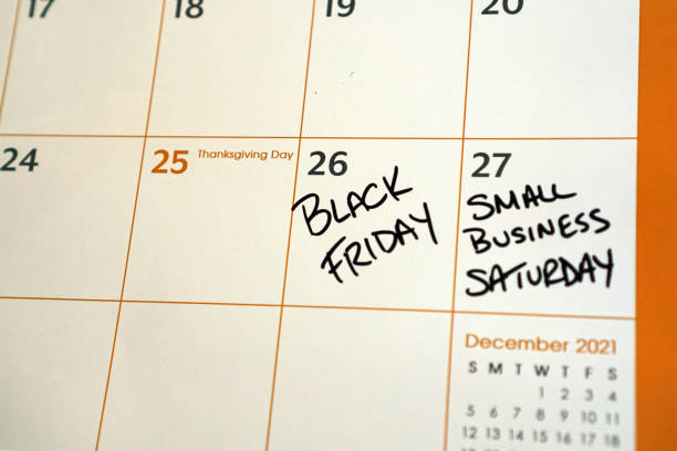 Small Business Saturday Written on Calendar Calendar reminder about Small Business Saturday, a day to shop local during the holiday shopping season. saturday stock pictures, royalty-free photos & images