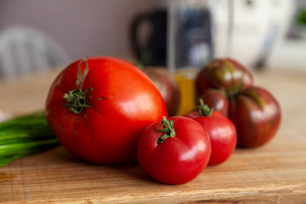 istock Tomatoes in close-up on a cutting board 1354253127