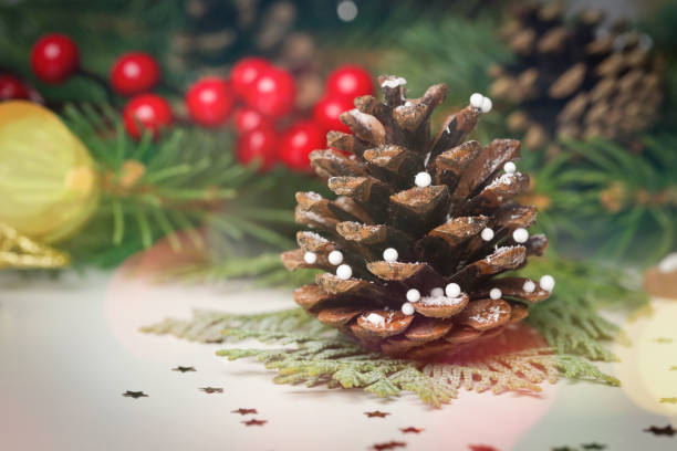 istock Christmas decoration with pine cones and blurred bokeh lights 1354253353