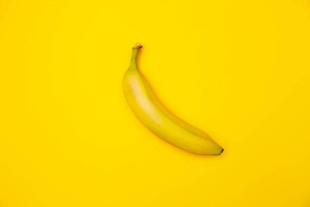 istock banana on a yellow background 1354254922