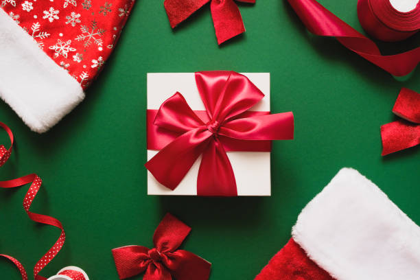 istock White gift with a red bow. Christmas or New Year background . 1354256428