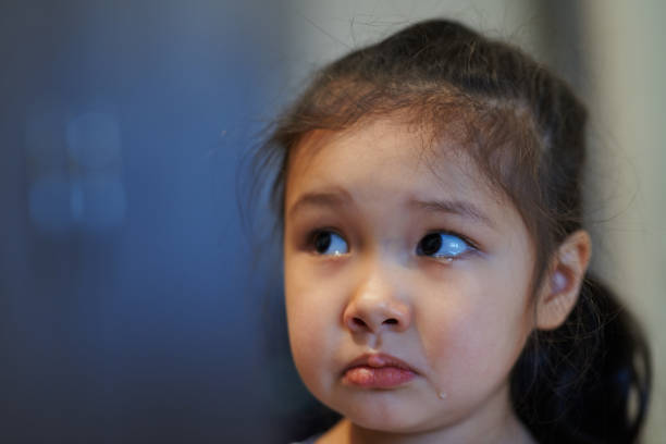 Young Asian girl from poverty stricken area in Manila, Philippines.