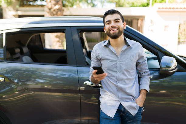 istock Attractive man waiting for friends in his car 1354257919