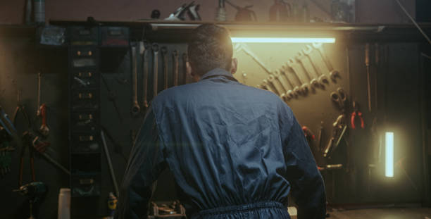 istock blacksmith, industry, man, face, looking at camera, standing, handmade, handwork, confident, background, turn, success, workbench, portrait, craftsmanship, worker, artisan, ethnic, young, handsome, sm 1354257980