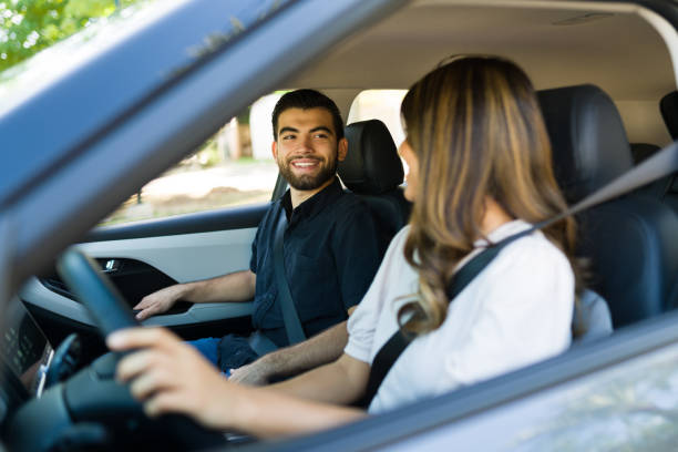 istock Happy couple driving home together 1354257983