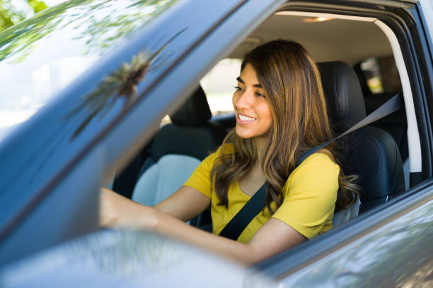 istock Excited woman behind the wheel 1354258012