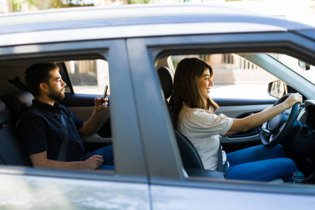 istock Latin driver and passenger in the car 1354258066